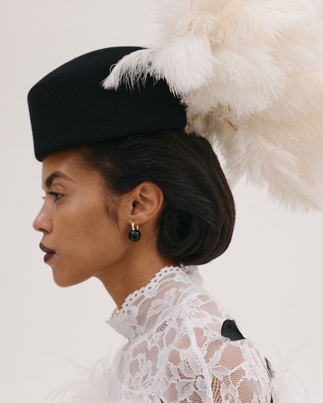 Hat In Black with White Feathers